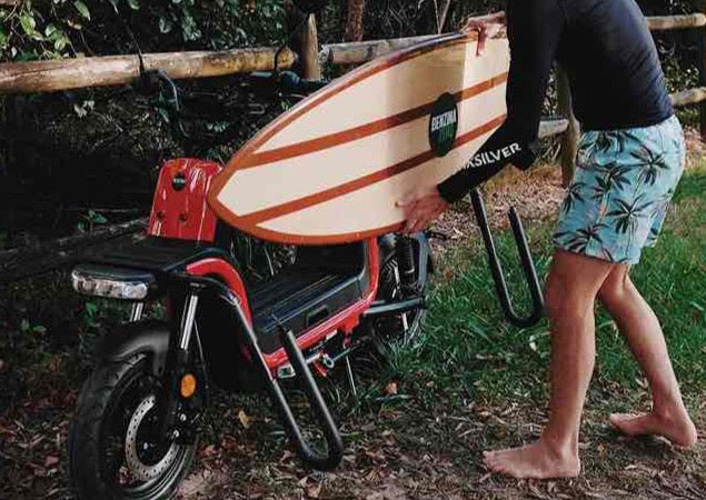 Benzina Zero electric moped scooter with surfboard rack.